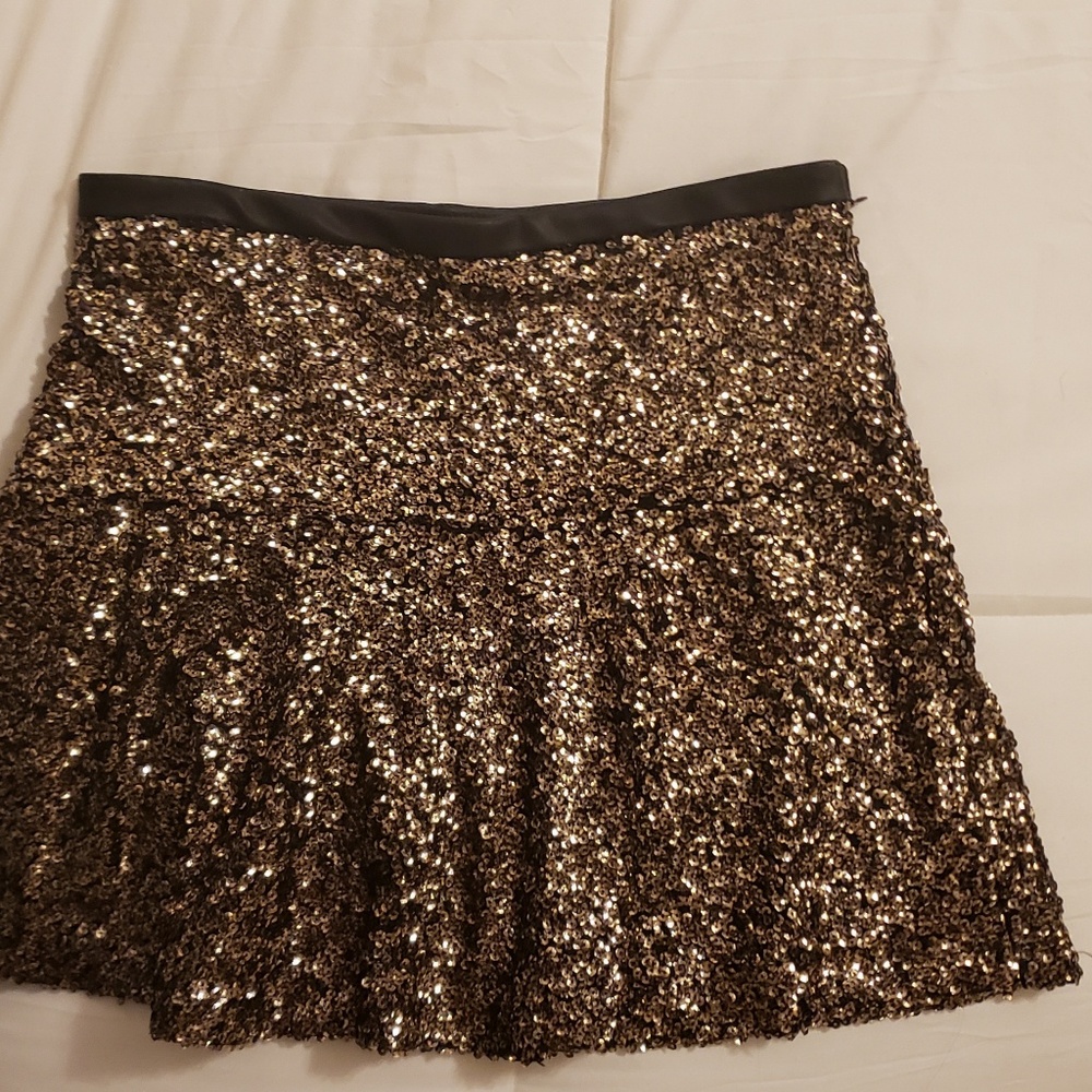 EXPRESS gold skirt with black leather trim. Lined
